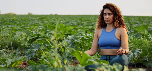 woman with kapha dosha meditating in field