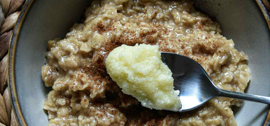 spoon of ghee butter over oatmeal