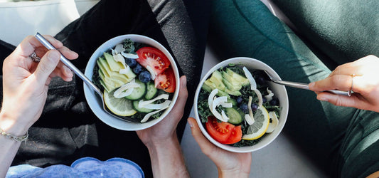 two bowls of vegetables and food