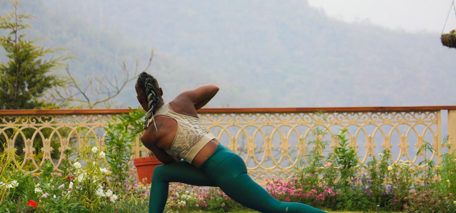 woman twisting in yoga for detox pose