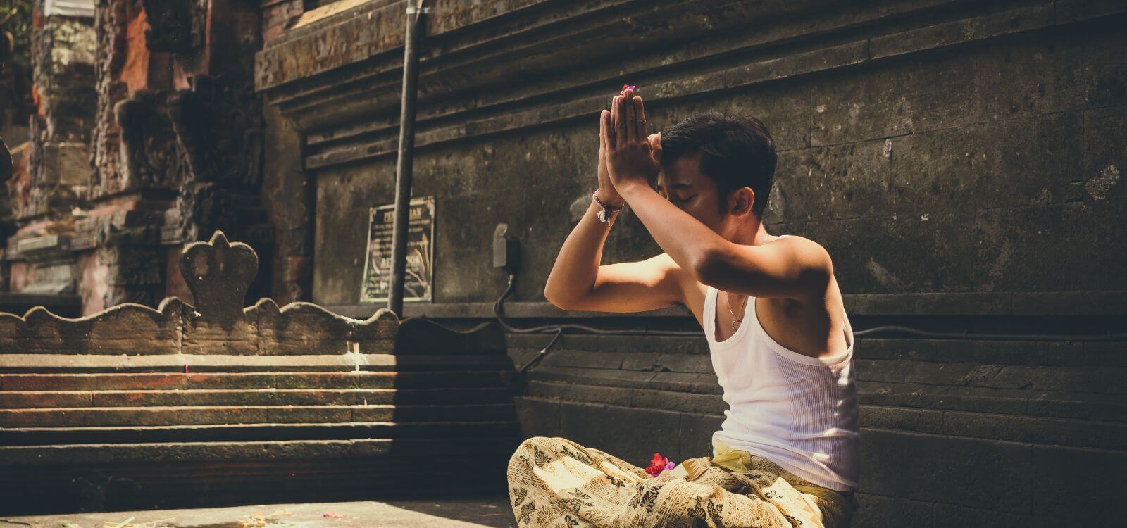 man in lotus pose practicing gratitude yoga