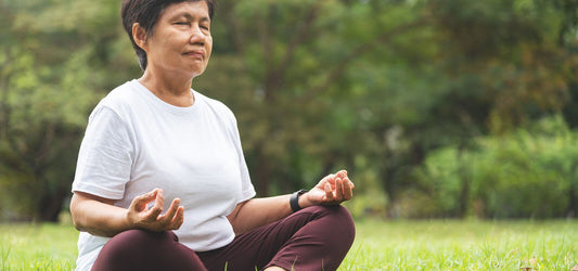 asian senior meditating