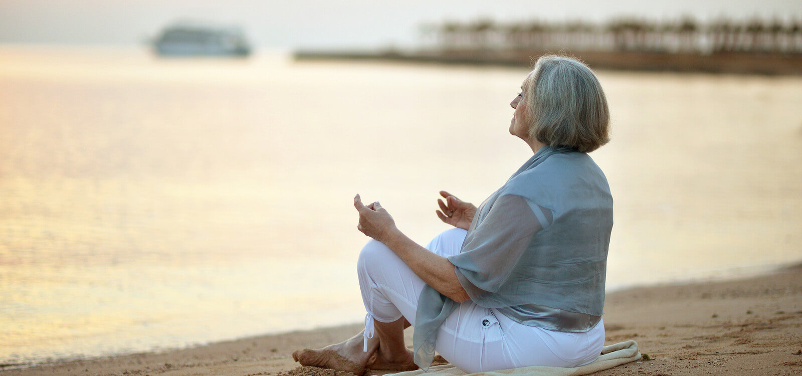 older woman meditating ayurveda for longevity