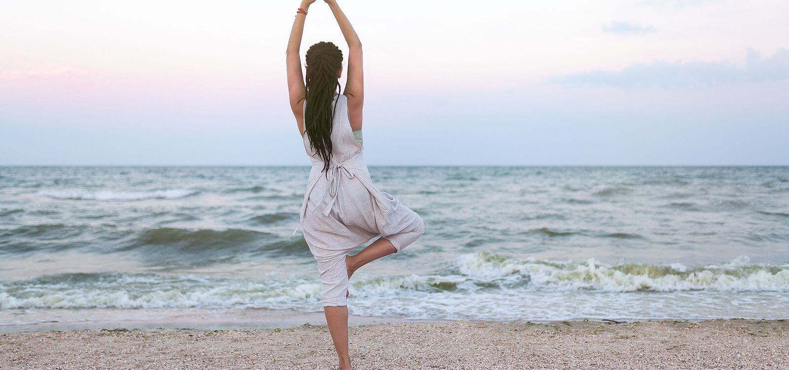 woman on beaching doing yoga for anxiety
