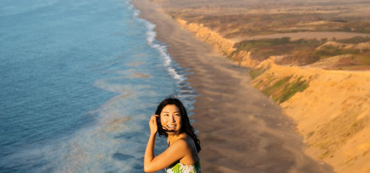 women with strong ojas on cliff overlooking sea