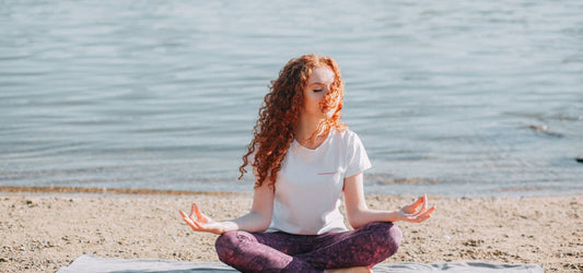 woman with red hair meditating