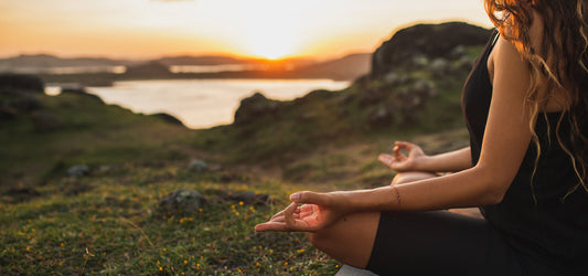 woman in morning meditation at sunrise