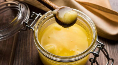 spoon of ghee from jar