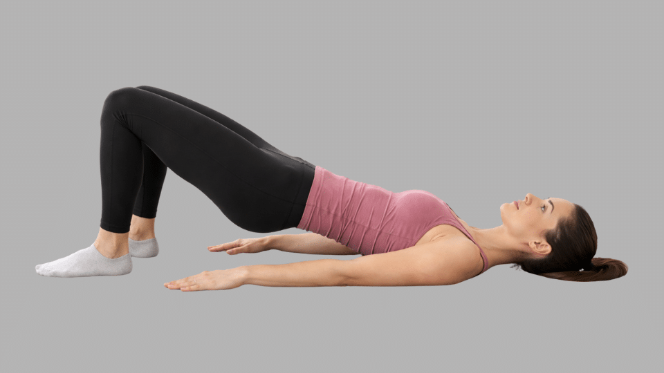 glute bridge on the floorbed