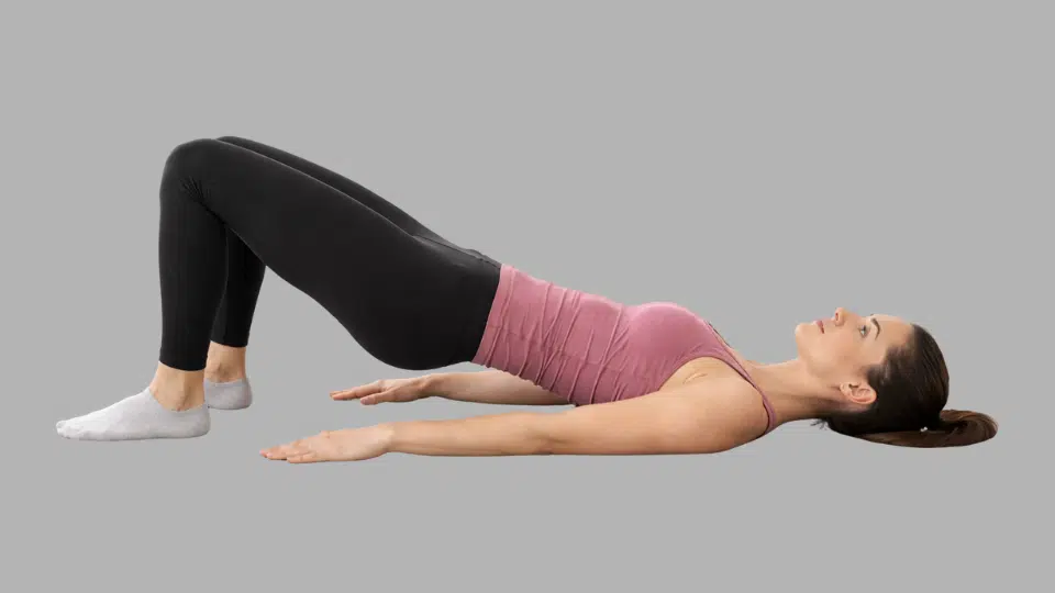 glute bridge on the floorbed