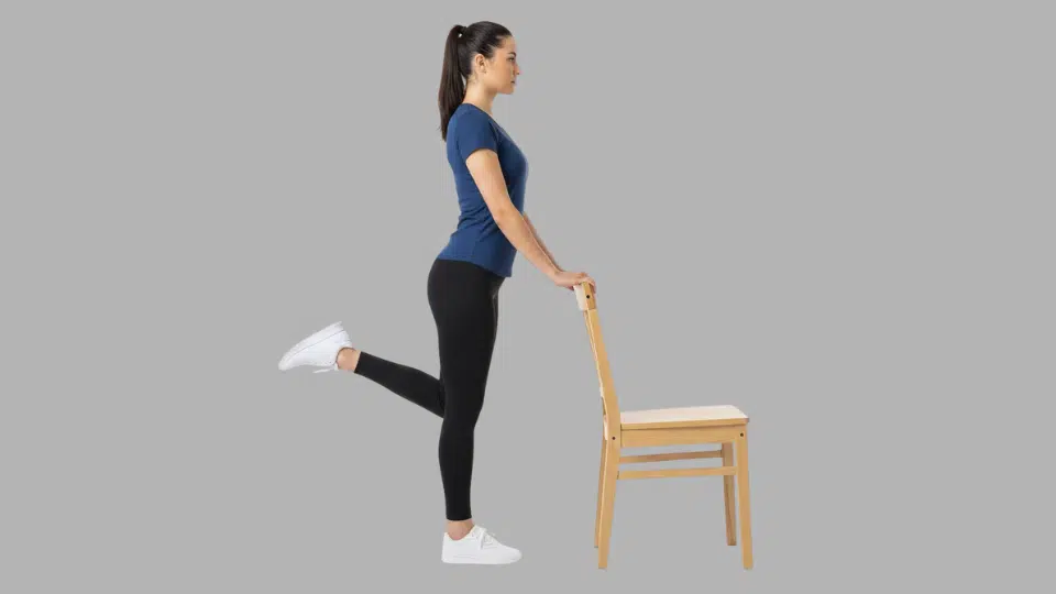 standing hamstring curls hold a chair