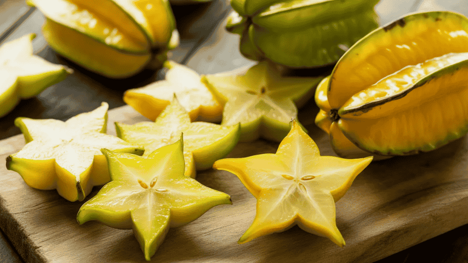 star fruit sliced into star shapes on wooden board naturally high in potassium for healthy fruit diet and nutrition
