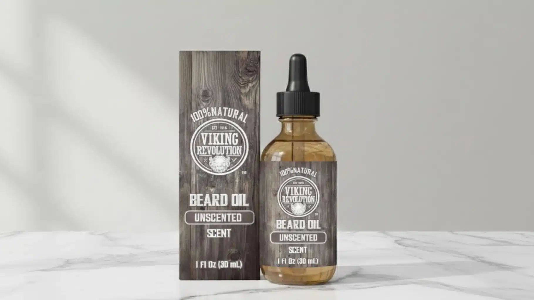 viking revolution unscented beard oil bottle with dropper beside branded box on a marble countertop