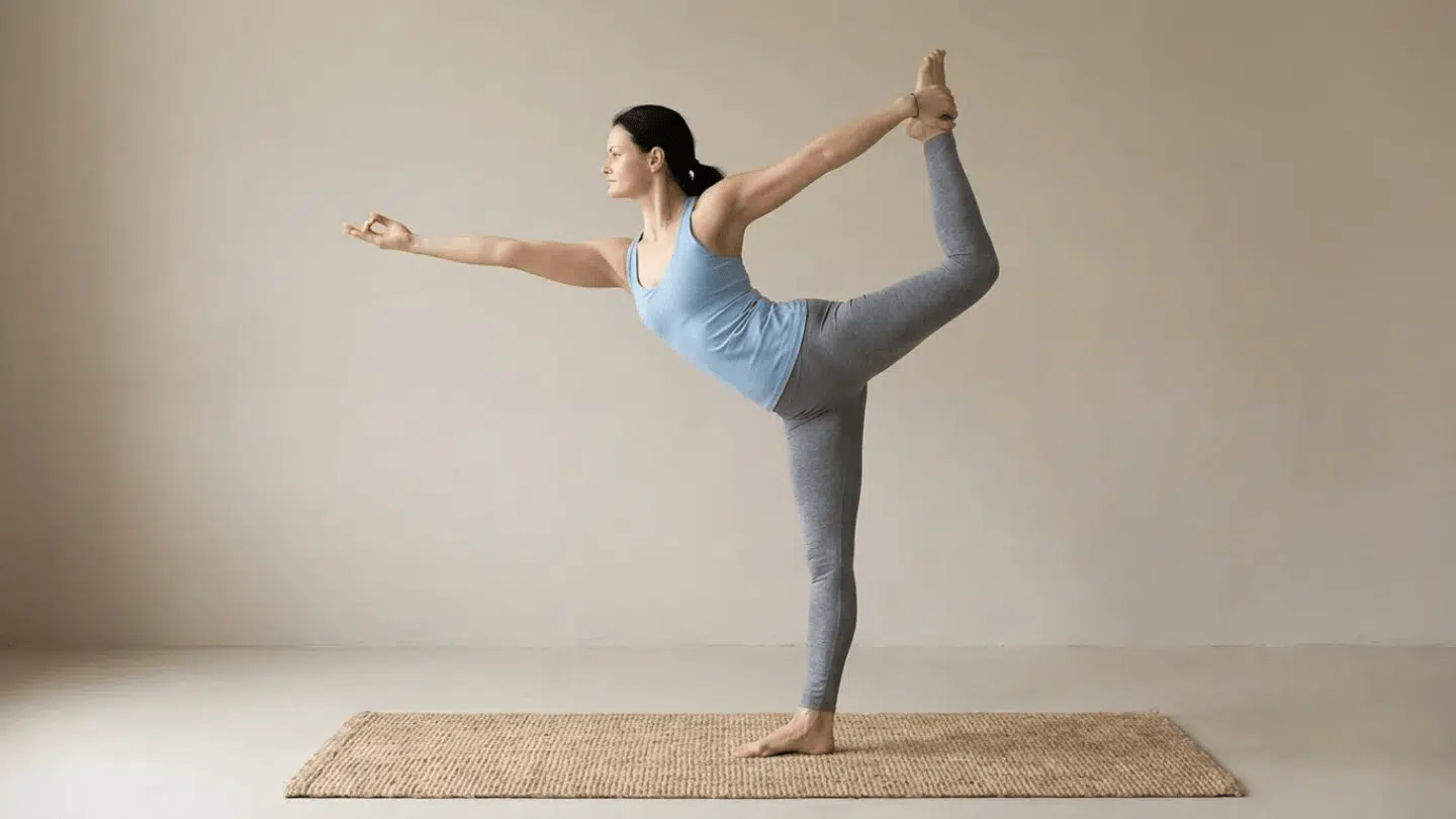 dancer pose natarajasana standing balance holding lifted foot behind opening chest and hips while maintaining steady posture