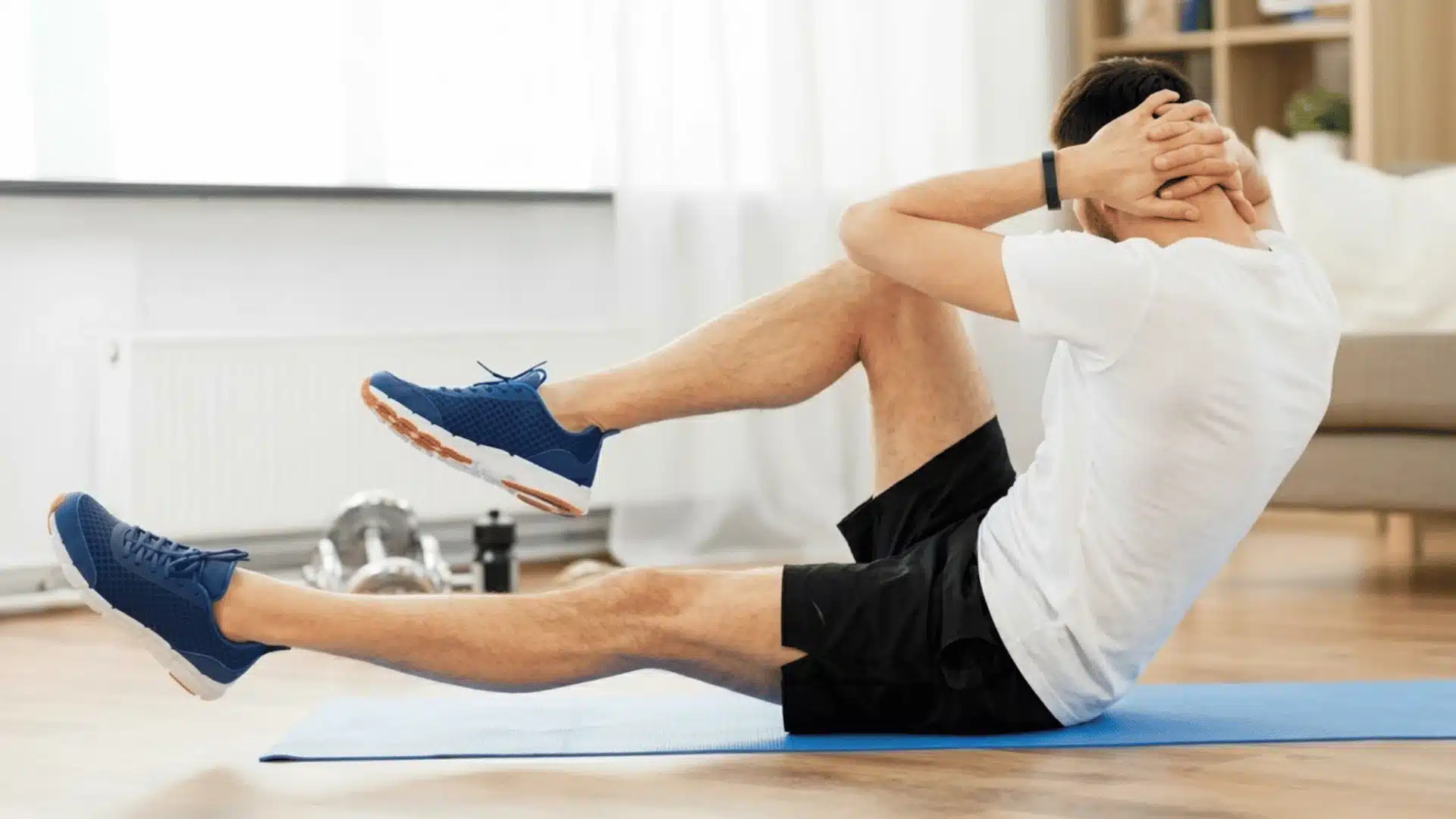 men doing performing a crunch exercise on a yoga mat against a speckled brown rubber flooring