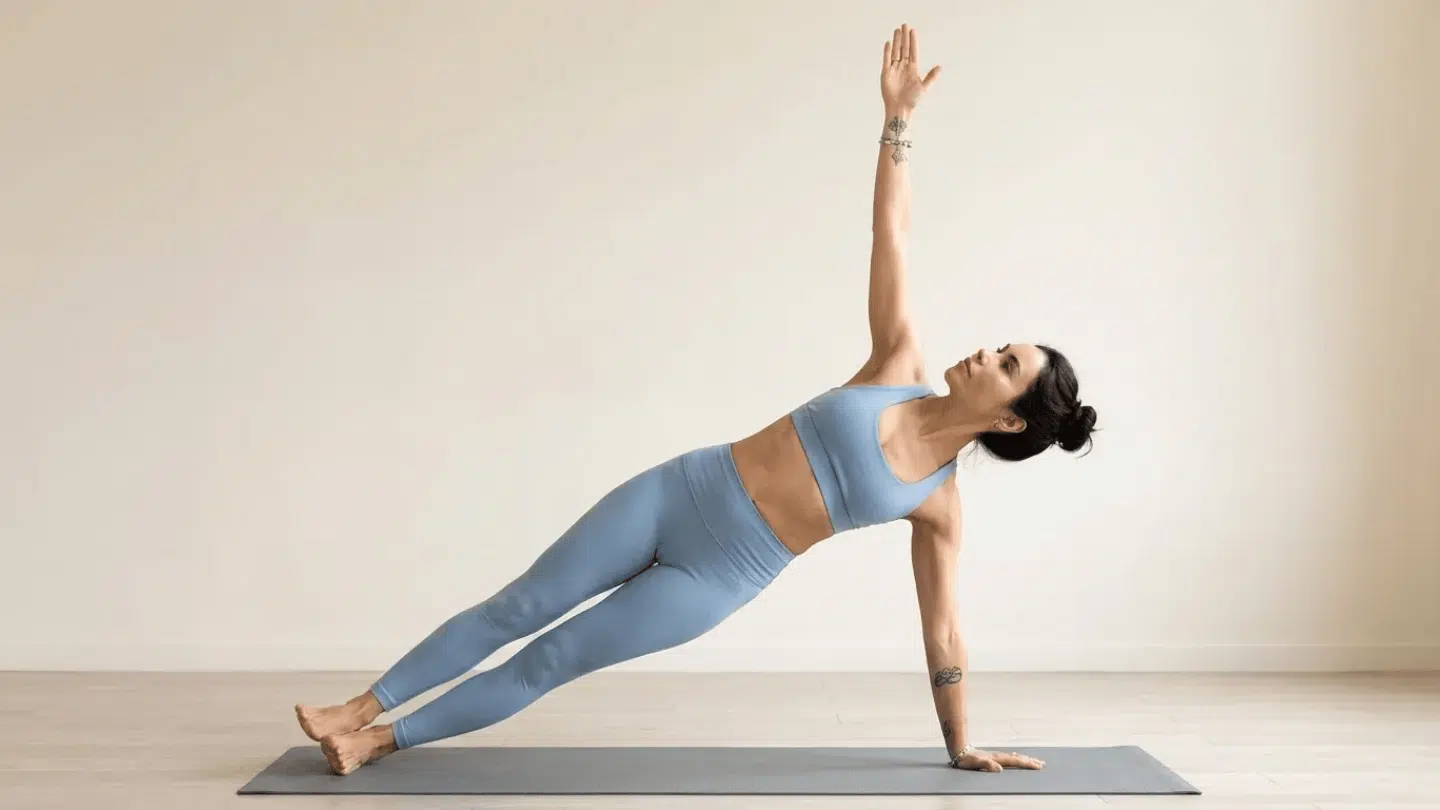 side plank vasisthasana balancing on one arm with body stacked sideways strengthening shoulders core and hip stability