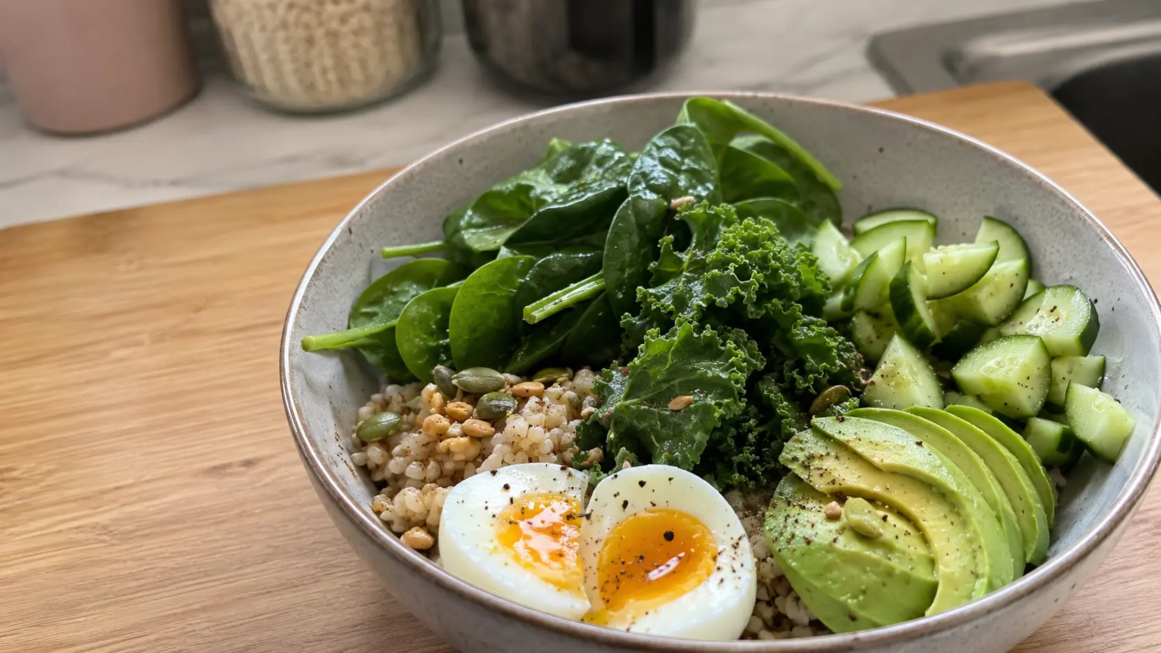 grain bowl with spinach kale avocado cucumber and egg