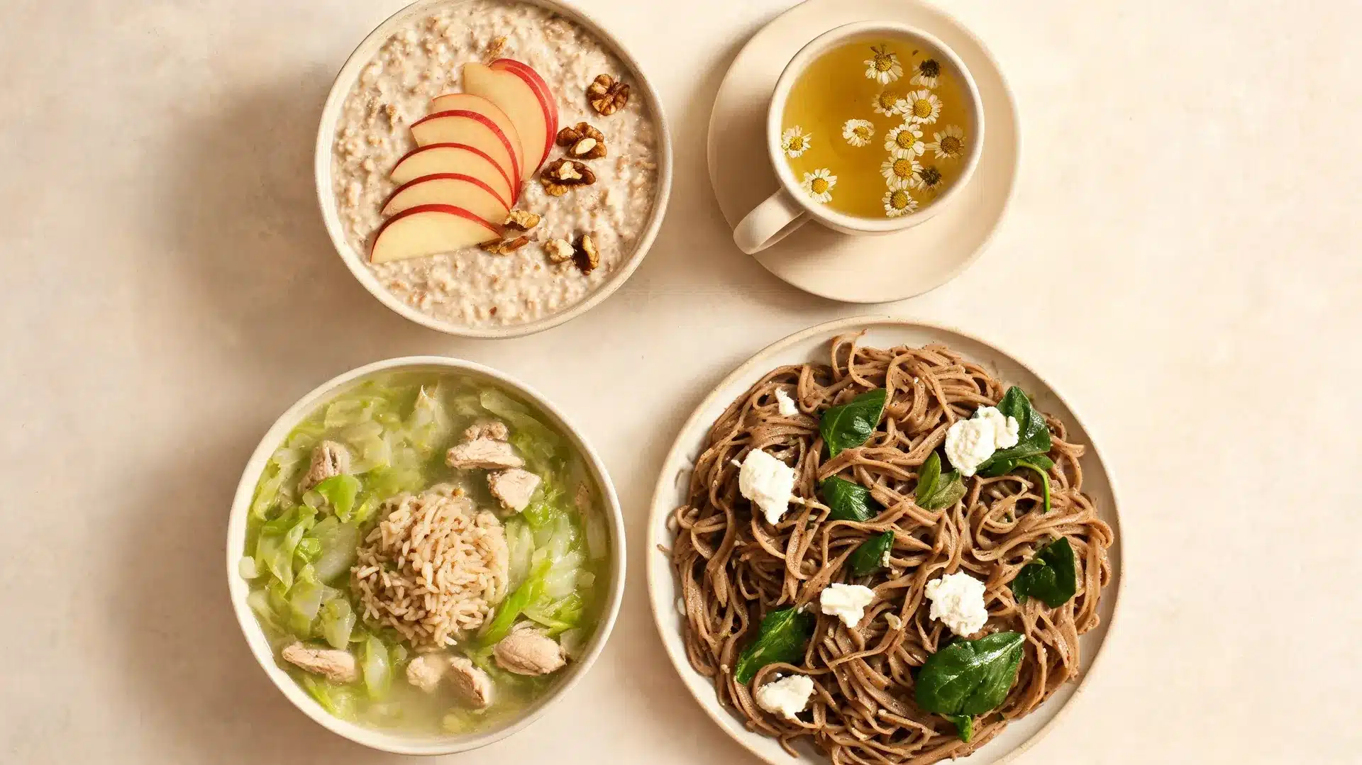 top view of oatmeal, chamomile tea, chicken cabbage soup, and spinach pasta with ricotta served on a light surface