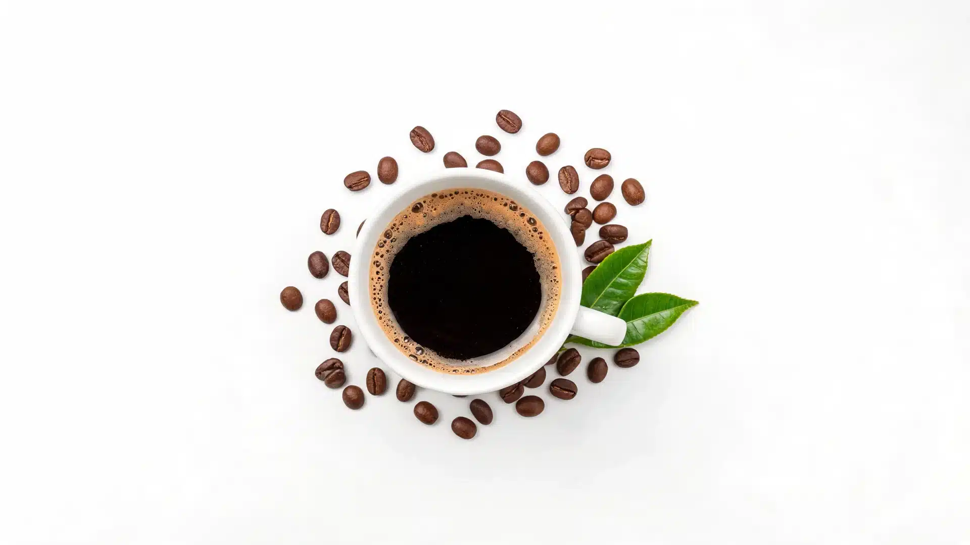 black-coffee-kidney-detox-juice-style-drink-in-a-white-cup-with-coffee-beans-and-leaves