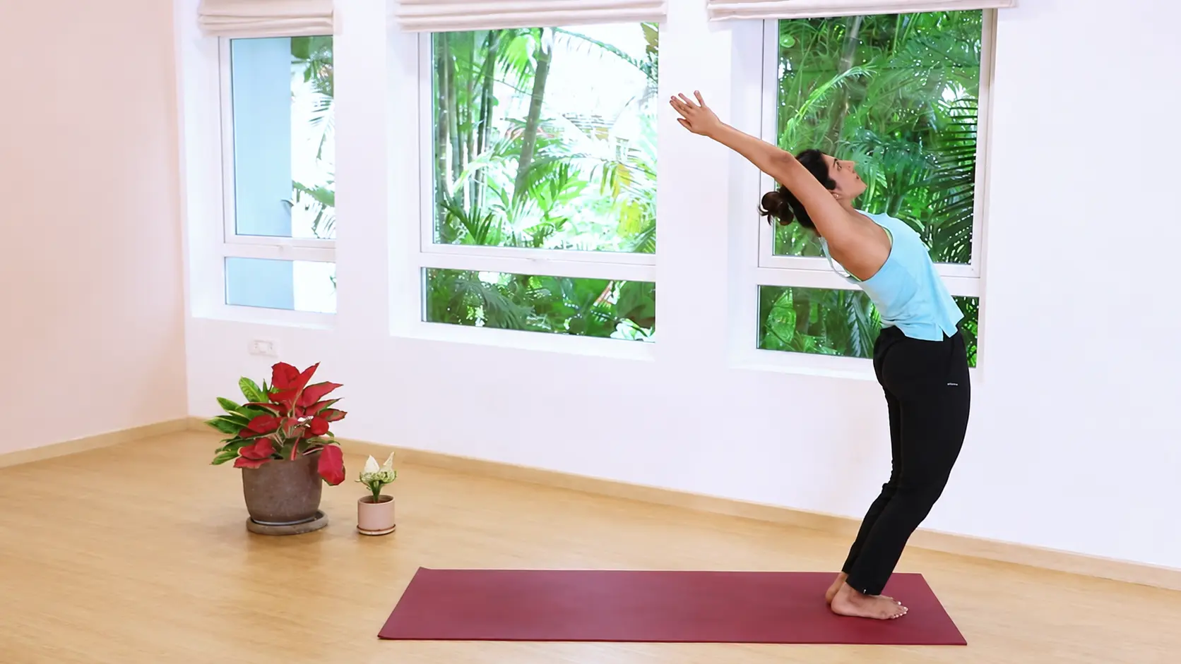 hasta uttanasana raised arms pose with arms reaching up and chest opening into a gentle backbend