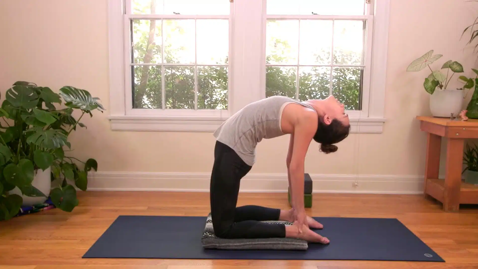 Full camel pose yoga with hands on heels controlled backbend