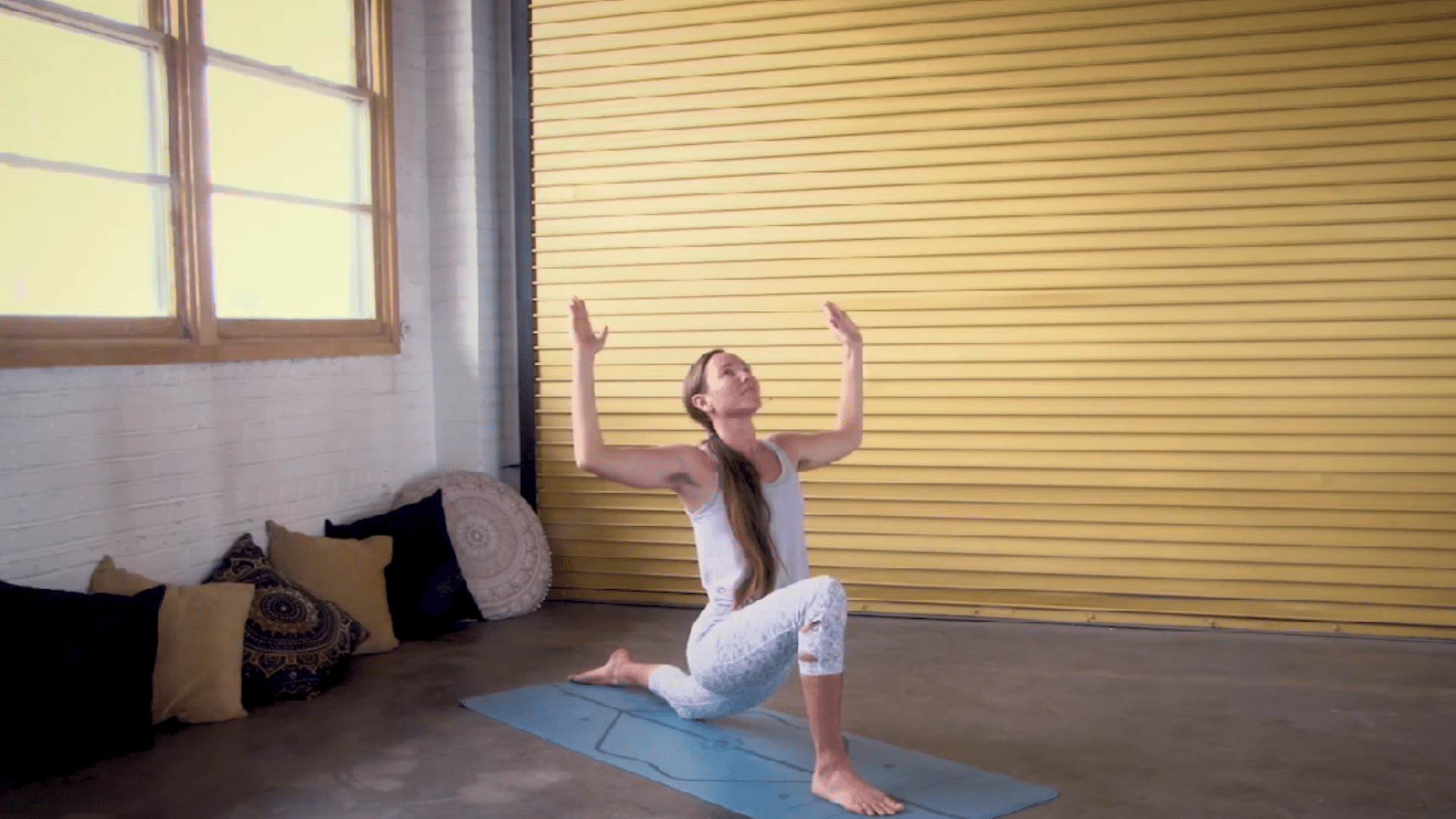 person lengthening the spine in low lunge while gently squaring the hips