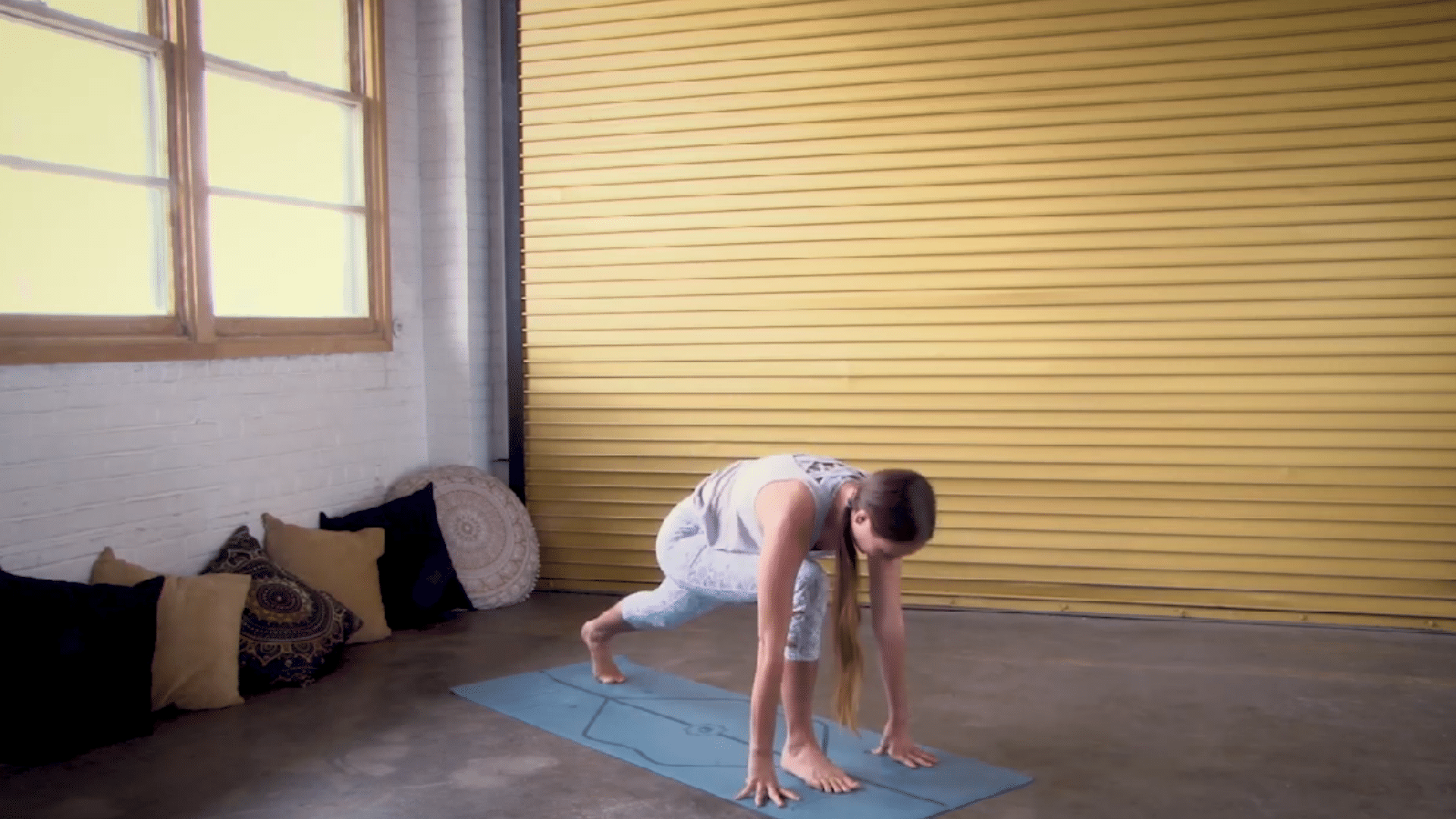 person placing one foot forward and one leg back to build a steady lunge base