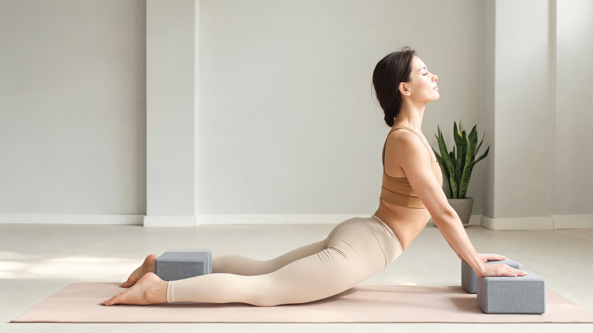 Yoga blocks beside ankles camel pose variation