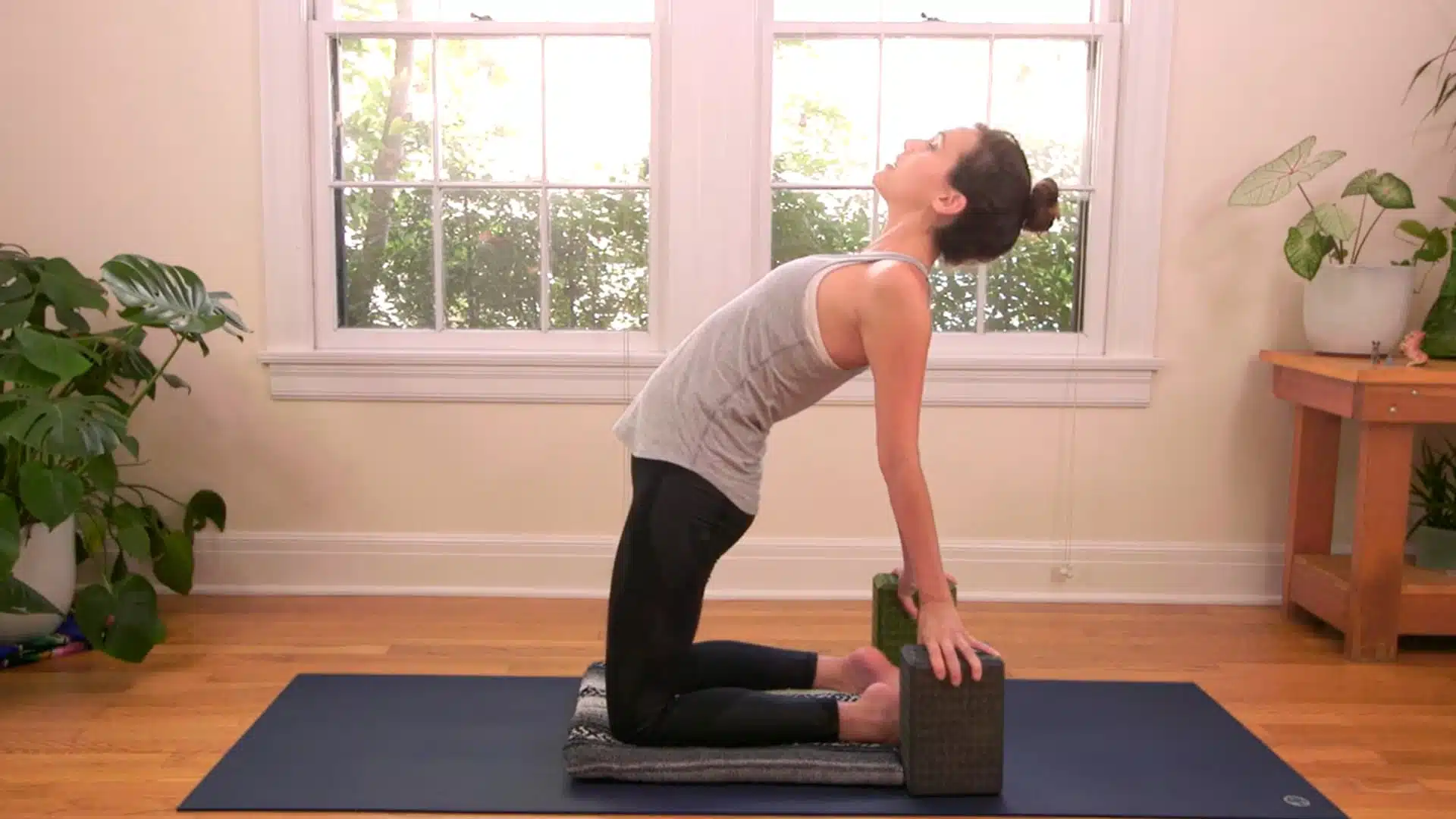 Yoga blocks beside heels camel pose modification