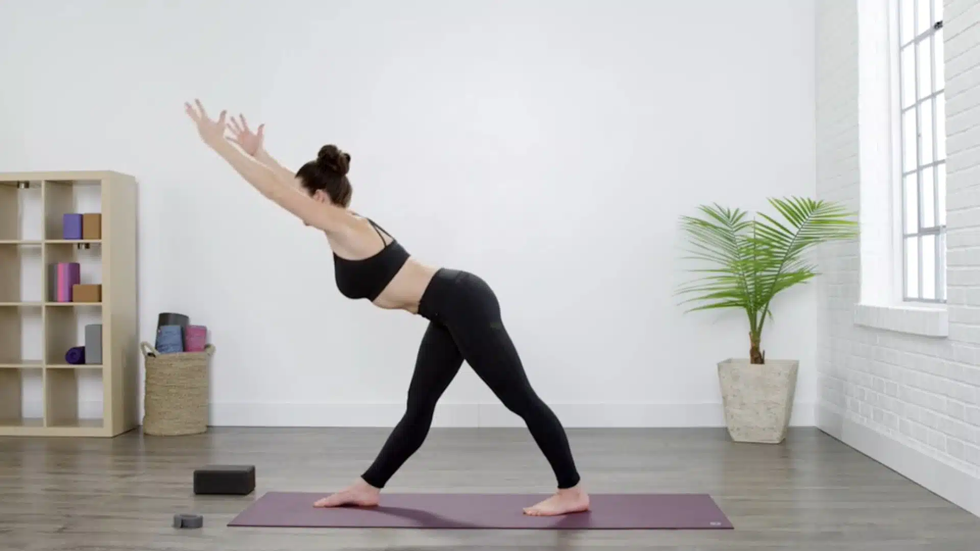 woman hinging forward with a long spine while preparing to enter pyramid pose (1)